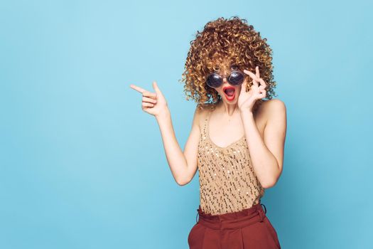 woman Surprised look hand gestures curly hair Studio Copy Space bright makeup close-up