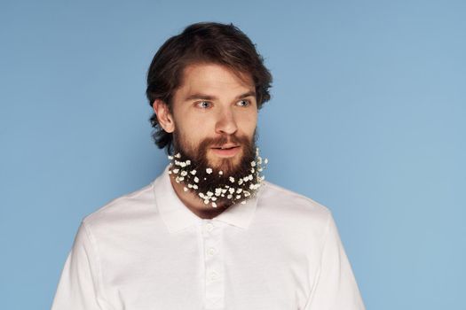 handsome man white shirt beard in colors emotions close-up blue background. High quality photo