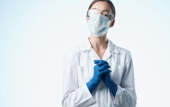 female doctor in a medical gown and blue gloves vaccination tests. High quality photo