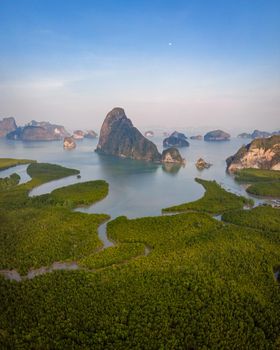 panorama view of Sametnangshe, view of mountains in Phangnga bay with mangrove forest in Andaman sea with evening twilight sky, travel destination in Phangnga, Thailand. South East Asia