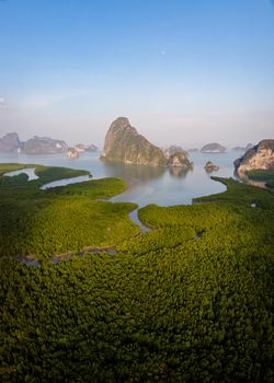 panorama view of Sametnangshe, view of mountains in Phangnga bay with mangrove forest in Andaman sea with evening twilight sky, travel destination in Phangnga, Thailand. South East Asia