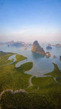 panorama view of Sametnangshe, view of mountains in Phangnga bay with mangrove forest in Andaman sea with evening twilight sky, travel destination in Phangnga, Thailand. South East Asia