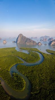panorama view of Sametnangshe, view of mountains in Phangnga bay with mangrove forest in Andaman sea with evening twilight sky, travel destination in Phangnga, Thailand. South East Asia