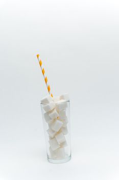 sugar cubes in a glass with a tube high-calorie cocktail. High quality photo