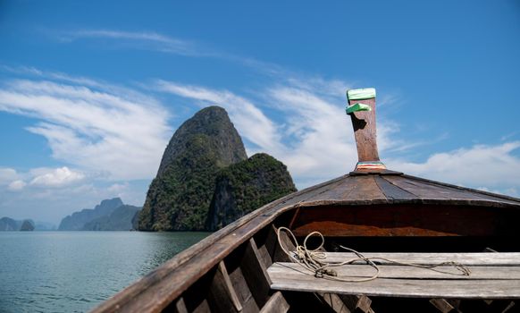 Head of wooden long tailed boat tour heading to beautiful Islands. Thailand Journey boat trip concept.