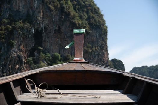 Head of wooden long tailed boat tour heading to beautiful Islands. Thailand Journey boat trip concept.