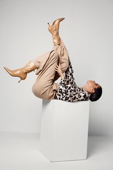 woman upside down leopard shirt cosmetics glamor. High quality photo