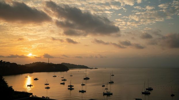 Yacht in the tropical ocean at dawn or sunset. Yachting Luxury Sailing.