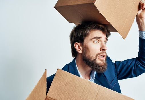 man with boxes in groups moving new place of work lifestyle official. High quality photo