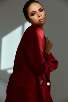 woman in red jacket cropped view bright makeup model. High quality photo