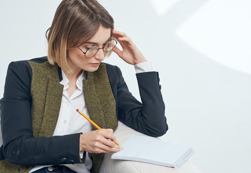 Business woman with documents and in a fashionable jacket. High quality photo