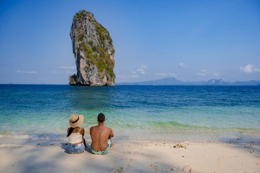 Koh Poda Island Thailand, couple mid age Asian woman and European man on the beach, Koh Poda Thailand, beautiful tropical beach of Koh Poda, Poda Island in Krabi province of Thailand South East Asian