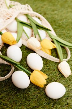 easter eggs bouquet flowers holiday tradition lawn background. High quality photo
