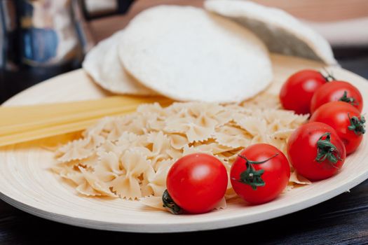 cherry tomatoes pasta ingredients for cooking italian cuisine lunch. High quality photo