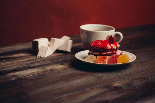cake on a saucer cup of tea sweets enjoyment snack. High quality photo
