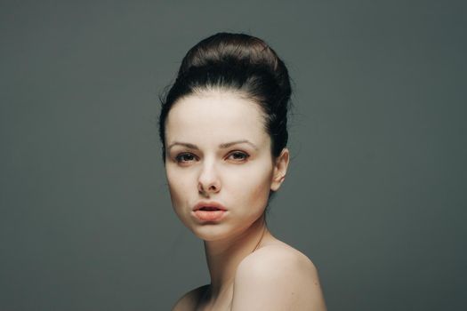 brunette bare shoulders gathered head hair glamor glamor. High quality photo