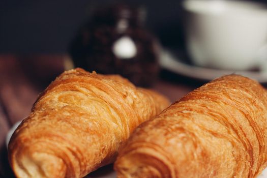 croissants in a plate on the table flour dessert coffee meal. High quality photo