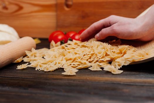 pasta italian cuisine ingredients cooking sauce wooden table. High quality photo