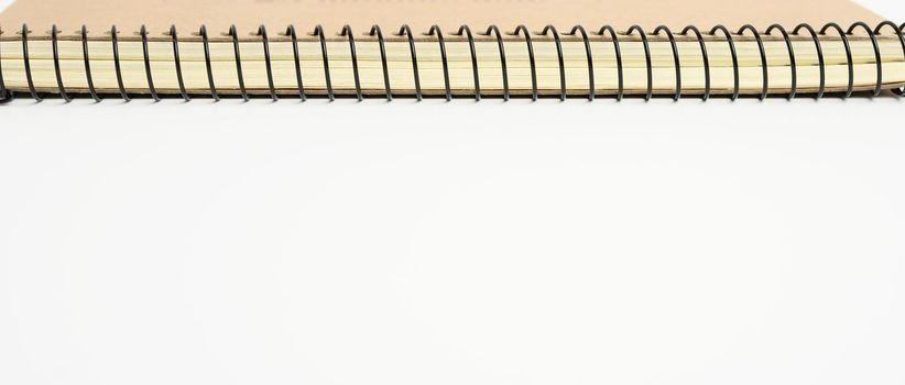 open spiral notebook with blank white sheets, close up