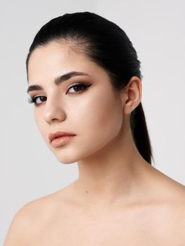 brunette face makeup naked shoulders clear skin model. High quality photo