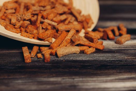 salty croutons snacks delicacy meal wooden table. High quality photo
