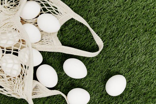 eggs in a bag lie on the lawn Easter holiday Christian day. High quality photo