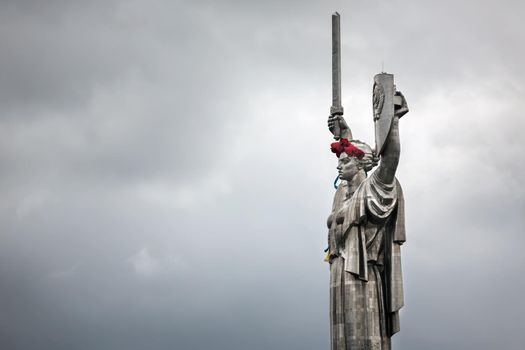 KIEV, UKRAINE - May. 08, 2015: Poppies of memory. The monument "Mother Motherland" decorated with a wreath of poppies on the Day of Remembrance and Reconciliation in Kiev