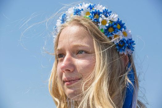 KIEV, UKRAINE - May. 09, 2015: Young woman in a wreath of flowers during the celebration of Victory Day in the square near the National Museum of the Great Patriotic War