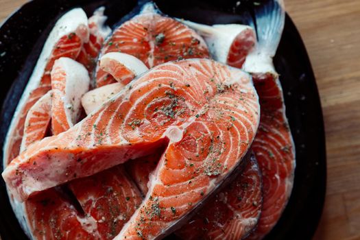 red fish on a plate steaks marinated in spices sea food. High quality photo