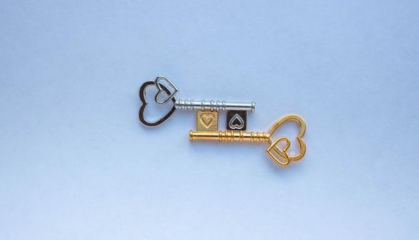 Gold and silver keys isolated on a white background.