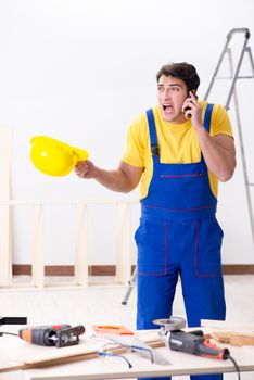 Floor repairman disappointed with his work 