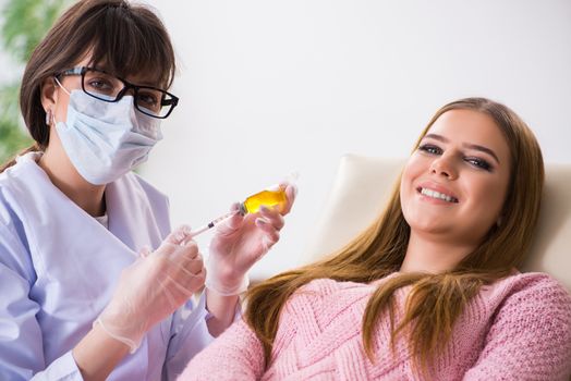 Woman patient visiting dentist for regular check-up