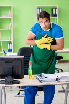 Male spy under cleaner cover stealing confidential documents