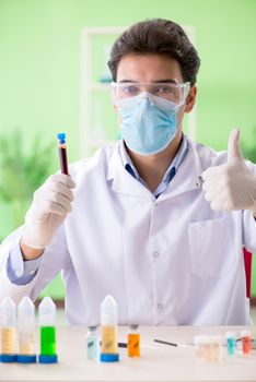 Man chemist working in the lab