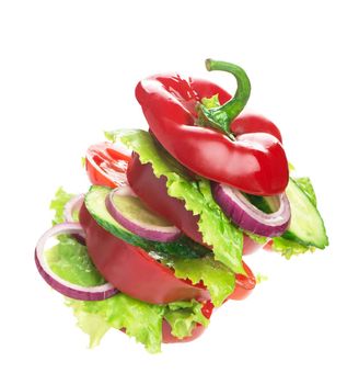 Creative layout made of tomato, bell pepper, cucumber and salad leaves mix