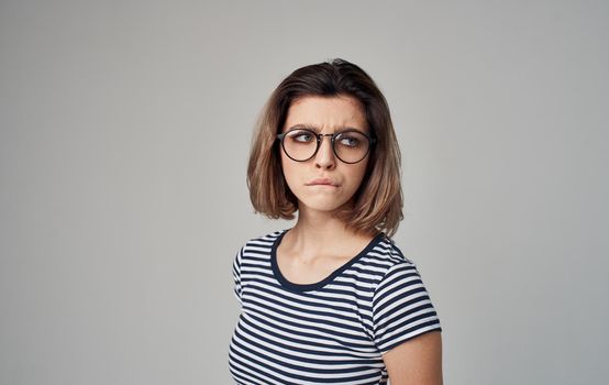 woman in striped t-shirt emotion smile glasses model. High quality photo