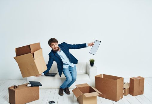 Business man picking up cardboard boxes and moving to a new place lifestyle. High quality photo