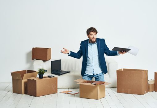 Business man unpacking boxes with things for an official Professional. High quality photo