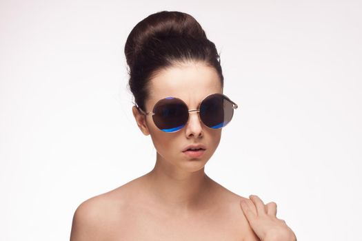 attractive woman with naked shoulders sunglasses fashion isolated background. High quality photo