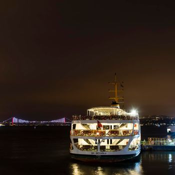 eminonu,istanbul,turkey-february 19,2021.city lines ferry at eminonu pier at dusk in the morning in istanbul city.