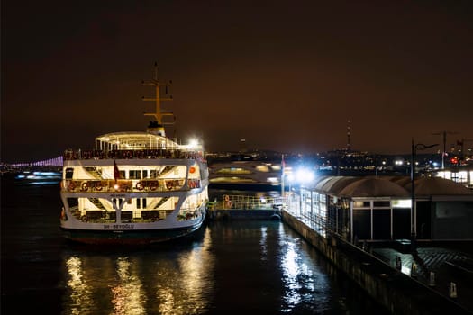 eminonu,istanbul,turkey-february 19,2021.city lines ferry at eminonu pier at dusk in the morning in istanbul city.