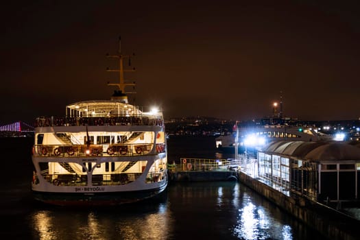 eminonu,istanbul,turkey-february 19,2021.city lines ferry at eminonu pier at dusk in the morning in istanbul city.