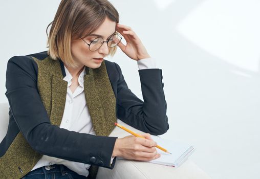 Business woman with documents and in a fashionable jacket. High quality photo
