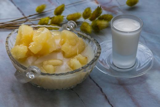 Cassava in syrup usually served with coconut milk on marble table. Traditional desserts in Thailand. Selective focus.