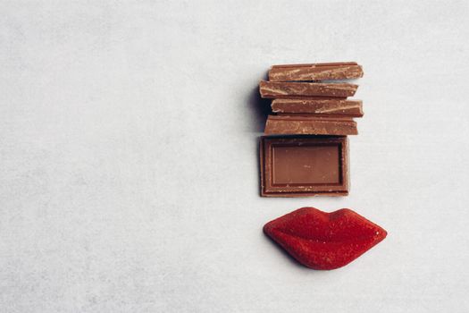 chocolate bar red lips marmalade sweets dessert top view. High quality photo