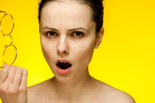 pretty woman with bare shoulders glasses in hands attractive look. High quality photo