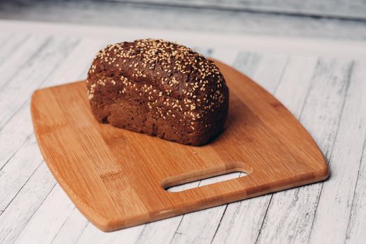 whole grain bread on wooden planks homemade pastries fresh aroma breakfast meal. High quality photo