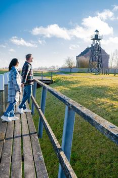 The former island Schokland. couple man and woman visit the former Island Schokland, The former island of Schokland was the first UNESCO World Heritage Site in the Netherlands. Holland