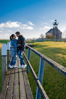The former island Schokland. couple man and woman visit the former Island Schokland, The former island of Schokland was the first UNESCO World Heritage Site in the Netherlands. Holland