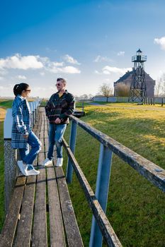 The former island Schokland. couple man and woman visit the former Island Schokland, The former island of Schokland was the first UNESCO World Heritage Site in the Netherlands. Holland